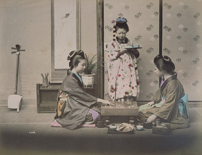 Women and a girl playing go